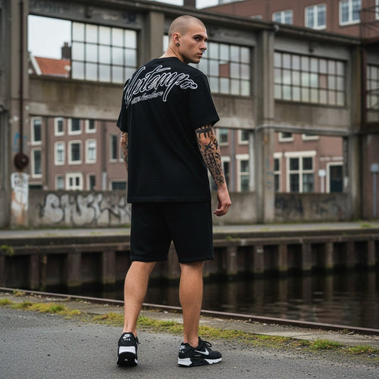 GABBERPLANET black cotton t-shirt with loose fit and signature logo print on back and chest.