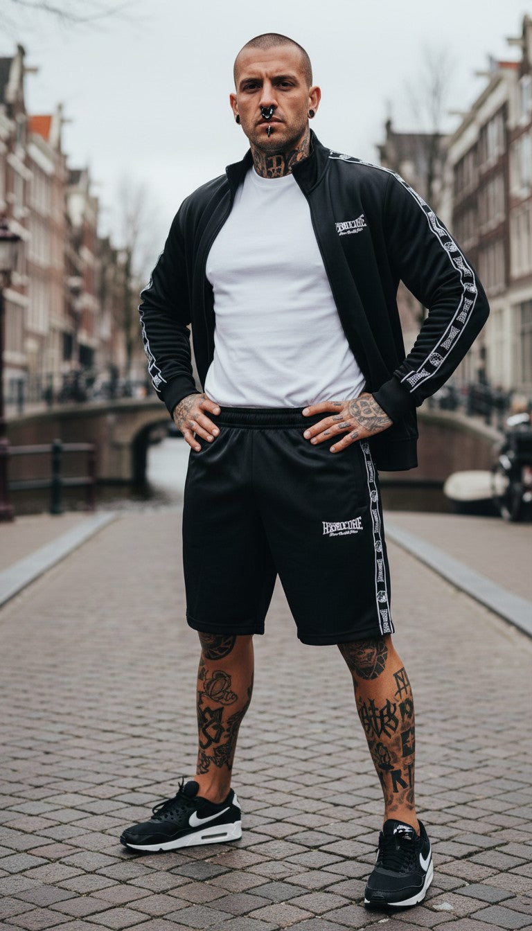 GABBERPLANET black polyester training shorts with woven taping and embroidered logo. Unisex fit.