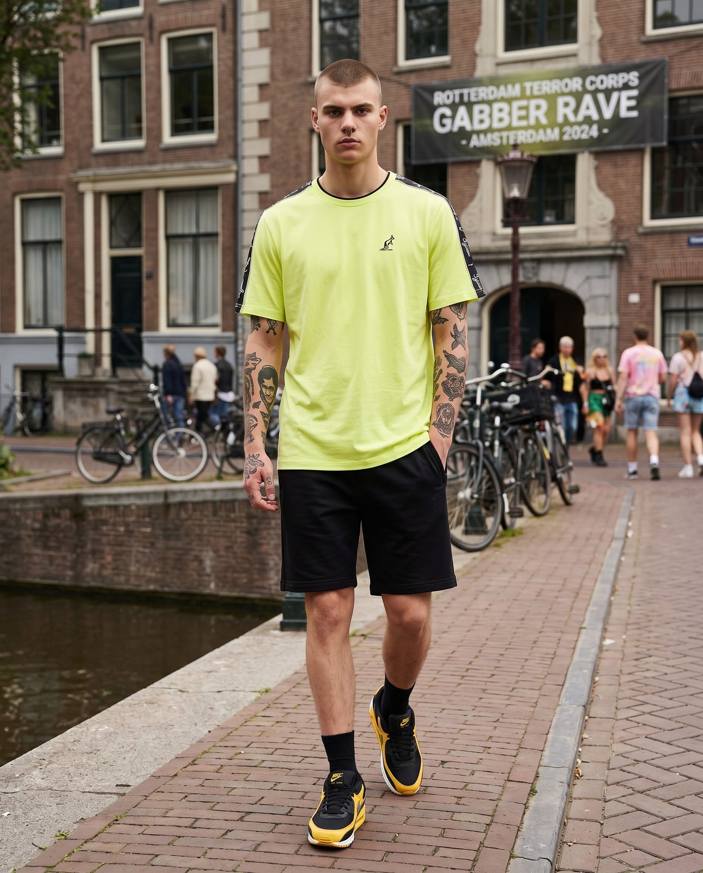GABBERPLANET bright yellow cotton t-shirt with black branded tape on shoulders and embroidered kangaroo logo.