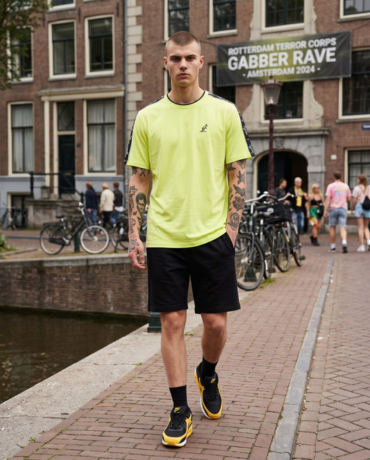 GABBERPLANET bright yellow cotton t-shirt with black branded tape on shoulders and embroidered kangaroo logo.
